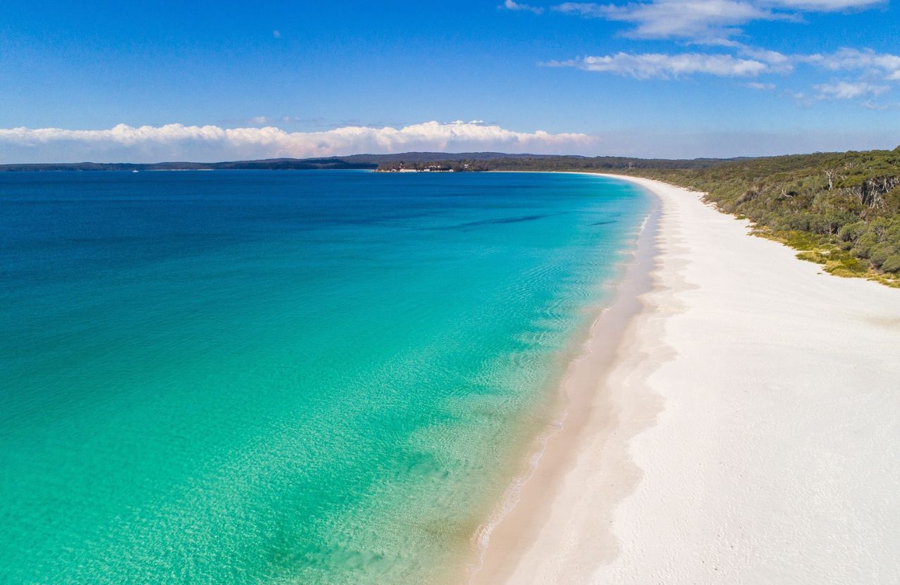 Hyams Beach, Jervis Bay: a ribbon of white sand beside clear turquoise water.