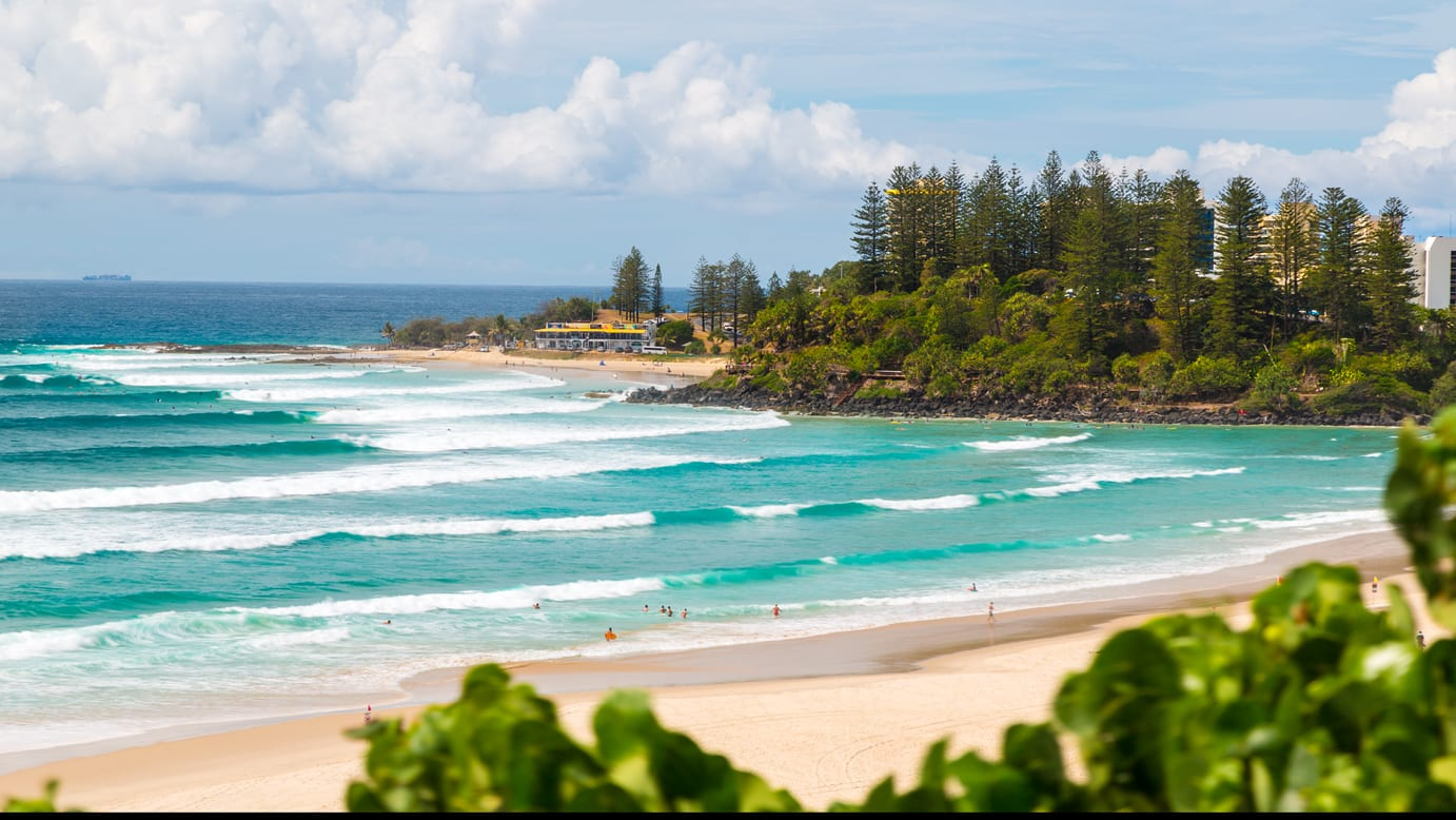 Snapper Rocks and Rainbow Bay from the headland, the point break running into the bay.
